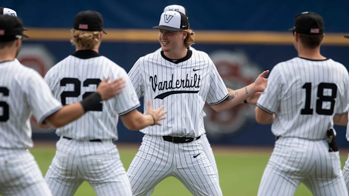 Vanderbilt Commodores players stretch between innings as Vanderbilt Commodores take on Tennessee Volunteer during the SEC baseball tournament at Hoover Met in Birmingham, Ala., on Saturday, May 24, 2025.