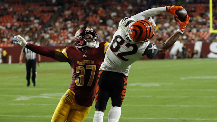 Aug 18, 2025; Landover, Maryland, USA; Cincinnati Bengals wide receiver Mitchell Tinsley (82) catches a touchdown pass as Washington Commanders cornerback Bobby Price (37) defends during the second quarter at Northwest Stadium. Mandatory Credit: Geoff Burke-Imagn Images Aug 18, 2025; Landover, Maryland, USA; Cincinnati Bengals wide receiver Mitchell Tinsley (82) catches a touchdown pass as Washington Commanders cornerback Bobby Price (37) defends during the second quarter at Northwest Stadium. Mandatory Credit: Geoff Burke-Imagn Images
