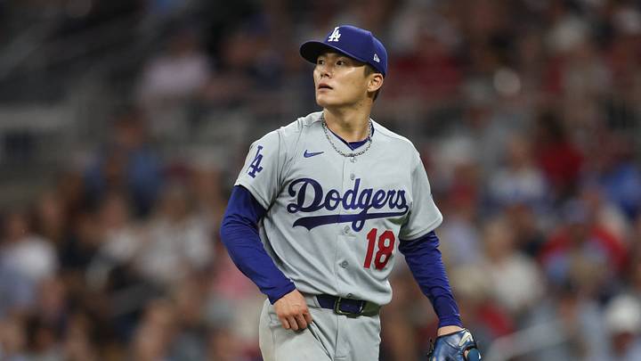 Oct 6, 2026; Cumberland, Georgia, USA;  Los Angeles Dodgers pitcher Yoshinobu Yamamoto (18) walks off the diamond after pitching against the Atlanta Braves during the seventh inning at Truist Park.  Mandatory Credit: Dale Zanine-Imagn Images