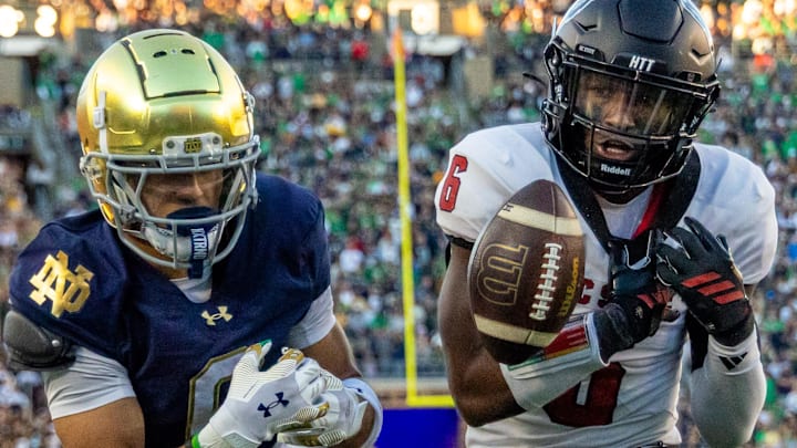 Oct 11, 2025; South Bend, Indiana, USA; NC State Wolfpack defensive back Devon Marshall (6) breaks up a pass intended for Notre Dame Fighting Irish wide receiver Jordan Faison (6) during the second half at Notre Dame Stadium. Mandatory Credit: Michael Caterina-Imagn Images