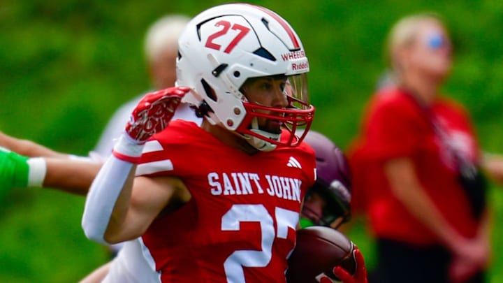 St. John's football senior Caden Wheeler runs the ball during the season opener against Minnesota-Morros on Sept. 13, 2025 at Clemens Stadium. The Johnnies won 49-0 St. John's football senior Caden Wheeler runs the ball during the season opener against Minnesota-Morros on Sept. 13, 2025 at Clemens Stadium. The Johnnies won 49-0