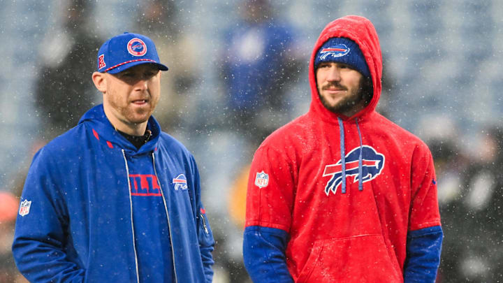 Buffalo Bills quarterback Josh Allen (17) speaks with Buffalo Bills Offensive Coordinator Joe Brady before the game against the Baltimore Ravens in a 2025 AFC divisional round game at Highmark Stadium. Buffalo Bills quarterback Josh Allen (17) speaks with Buffalo Bills Offensive Coordinator Joe Brady before the game against the Baltimore Ravens in a 2025 AFC divisional round game at Highmark Stadium.