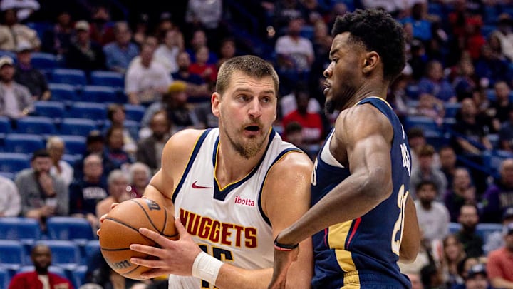 Nov 19, 2025; New Orleans, Louisiana, USA; Denver Nuggets center Nikola Jokić (15) fights for position against New Orleans Pelicans center Yves Missi (21) during the first half at Smoothie King Center. Nov 19, 2025; New Orleans, Louisiana, USA; Denver Nuggets center Nikola Jokić (15) fights for position against New Orleans Pelicans center Yves Missi (21) during the first half at Smoothie King Center.