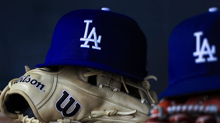 Jul 30, 2025; Cincinnati, Ohio, USA; A general view of a Los Angeles Dodgers hat and glove during the second inning in the game against the Cincinnati Reds at Great American Ball Park. Mandatory Credit: Katie Stratman-Imagn Images