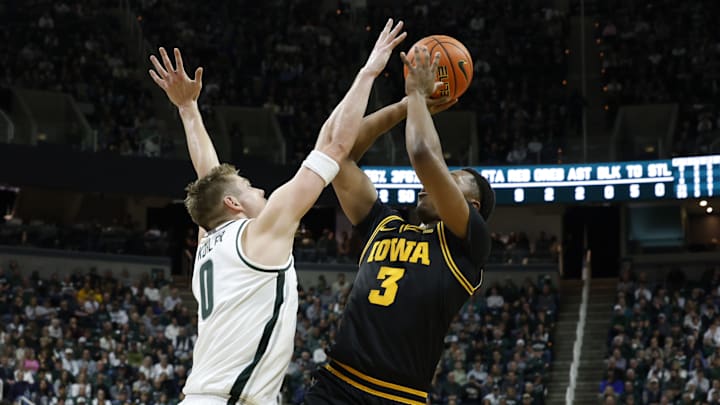 Michigan State Spartans forward Jaxon Kohler (0) contests a shot from Iowa Hawkeyes forward Cam Manyawu (3) at the Breslin Center on Tuesday, Dec. 2, 2025.