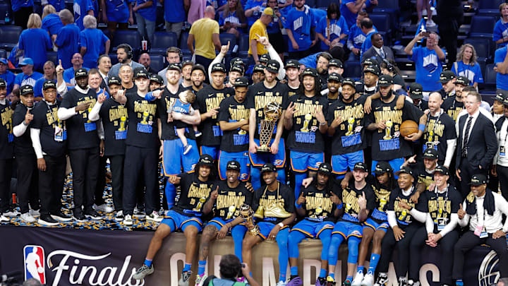 Jun 22, 2025; Oklahoma City, Oklahoma, USA; The Oklahoma City Thunder pose for a team photo with the Larry O'Brien Championship Trophy as they celebrate after winning game seven of the 2025 NBA Finals against the Indiana Pacers at Paycom Center. Mandatory Credit: Alonzo Adams-Imagn Images Jun 22, 2025; Oklahoma City, Oklahoma, USA; The Oklahoma City Thunder pose for a team photo with the Larry O'Brien Championship Trophy as they celebrate after winning game seven of the 2025 NBA Finals against the Indiana Pacers at Paycom Center. Mandatory Credit: Alonzo Adams-Imagn Images