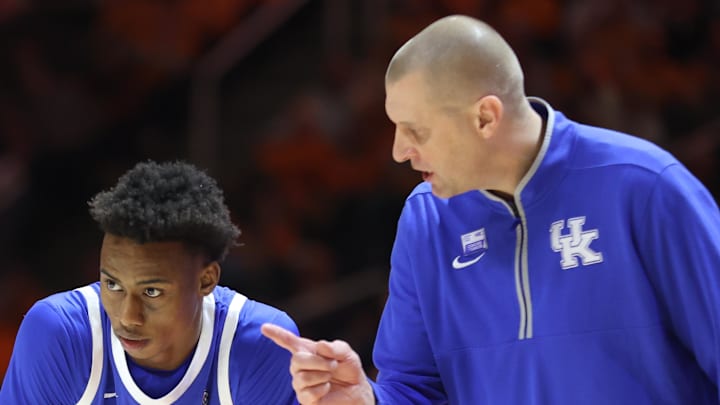 Kentucky Wildcats coach Mark Pope directs guard Jaxson Robinson, the former Razorback, during the Wildcats' 78-73 upset over the No. 8 Tennessee Volunteers on Tuesday at Thompson-Boling Arena in Knoxville, Tenn.