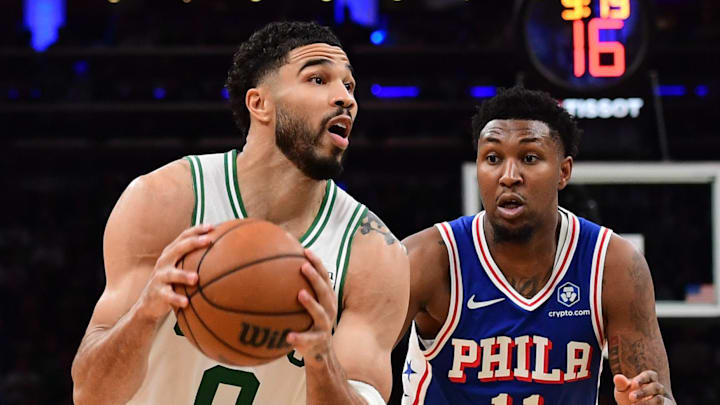 Apr 19, 2026; Boston, Massachusetts, USA; Boston Celtics forward Jayson Tatum (0) controls the ball ahead of Philadelphia 76ers forward Justin Edwards (11) in the second half during game one of the first round of the 2026 NBA Playoffs at TD Garden. Mandatory Credit: Bob DeChiara-Imagn Images