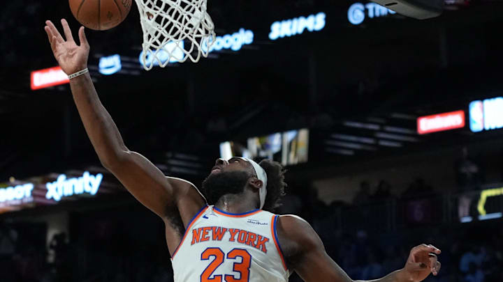 Dec 13, 2025; Las Vegas, Nevada, USA; New York Knicks center Mitchell Robinson (23) attempts to grab the rebound as Orlando Magic  Paolo Banchero (5) looks on during the first quarter at T-Mobile Arena. Mandatory Credit: Kirby Lee-Imagn Images