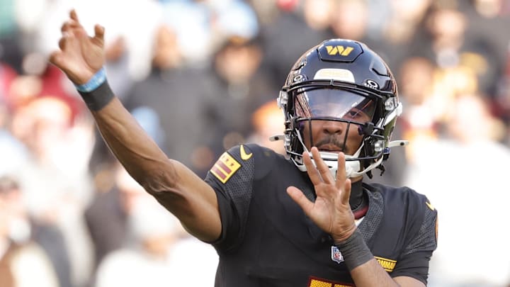 Dec 1, 2024; Landover, Maryland, USA; Washington Commanders quarterback Jayden Daniels (5) throws a pass during the first half against the Tennessee Titans at Northwest Stadium. Mandatory Credit: Amber Searls-Imagn Images