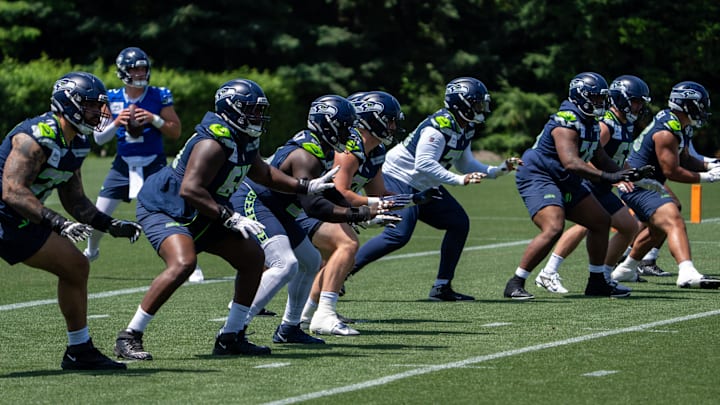 Jun 11, 2025; Renton, WA, USA; Seattle Seahawks offensive line units take part in drills during mini-camp at Virginia Mason Athletic Center.