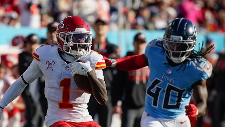 Kansas City Chiefs wide receiver Xavier Worthy (1) tries to escape Tennessee Titans cornerback Kemon Hall (40) during the third quarter at Nissan Stadium in Nashville, Tenn., Sunday, Dec. 21, 2025. Kansas City Chiefs wide receiver Xavier Worthy (1) tries to escape Tennessee Titans cornerback Kemon Hall (40) during the third quarter at Nissan Stadium in Nashville, Tenn., Sunday, Dec. 21, 2025.