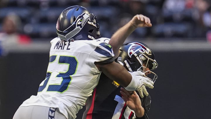 Seattle Seahawks linebacker Boye Mafe (53) hits Atlanta Falcons quarterback Kirk Cousins (18) 