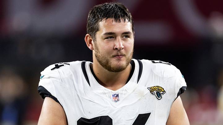 Nov 23, 2025; Glendale, Arizona, USA; Jacksonville Jaguars offensive lineman Wyatt Milum (64) against the Arizona Cardinals at State Farm Stadium. Mandatory Credit: Mark J. Rebilas-Imagn Images