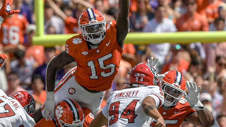 Sep 21, 2024; Clemson, South Carolina, USA; Clemson Tigers defensive end Jahiem Lawson (15) jumps during an extra point by North Carolina State Wolfpack kicker Kanoah Vinesett (94) during the first quarter at Memorial Stadium. Mandatory Credit: Ken Ruinard-Imagn Images