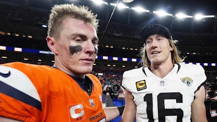 Dec 21, 2025; Denver, Colorado, USA; Denver Broncos quarterback Bo Nix (10) and Jacksonville Jaguars quarterback Trevor Lawrence (16) meet after the game at Empower Field at Mile High. Mandatory Credit: Ron Chenoy-Imagn Images