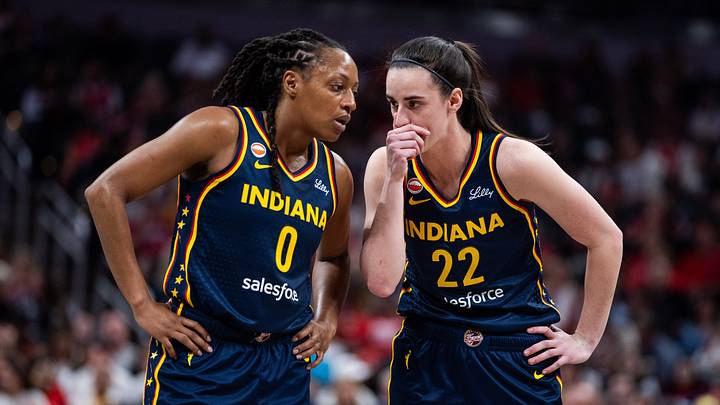 Indiana Fever guard Kelsey Mitchell (0) and guard Caitlin Clark (22) talk during a game. Indiana Fever guard Kelsey Mitchell (0) and guard Caitlin Clark (22) talk during a game.