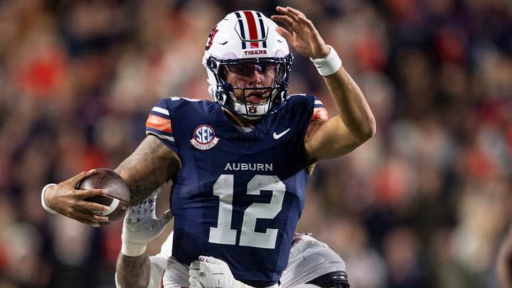 Auburn Tigers quarterback Ashton Daniels (12) runs the ball as Auburn Tigers take on Alabama Crimson Tide in the Iron Bowl at Jordan-Hare Stadium in Auburn, Ala. on Saturday, Nov. 29, 2025. Alabama Crimson Tide leads Auburn Tigers 17-6. Auburn Tigers quarterback Ashton Daniels (12) runs the ball as Auburn Tigers take on Alabama Crimson Tide in the Iron Bowl at Jordan-Hare Stadium in Auburn, Ala. on Saturday, Nov. 29, 2025. Alabama Crimson Tide leads Auburn Tigers 17-6.