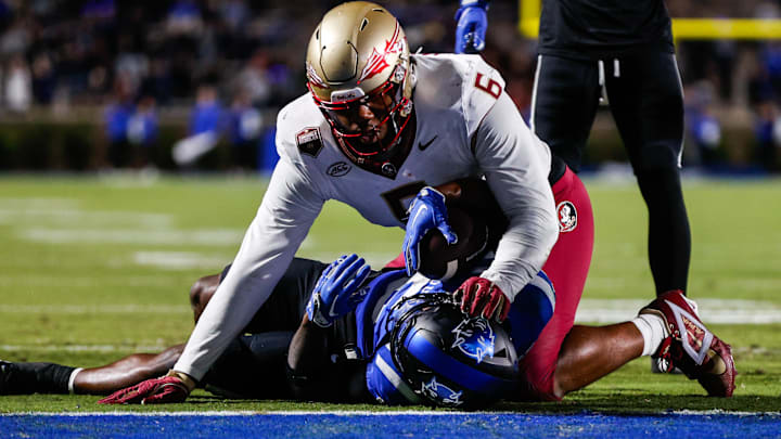 Oct 18, 2024; Durham, North Carolina, USA; Duke Blue Devils quarterback Maalik Murphy (6) attempts to run the ball to the end zone but is tacked by Florida State Seminoles defensive lineman Darrell Jackson Jr. (6) during the first half of the game at Wallace Wade Stadium. 