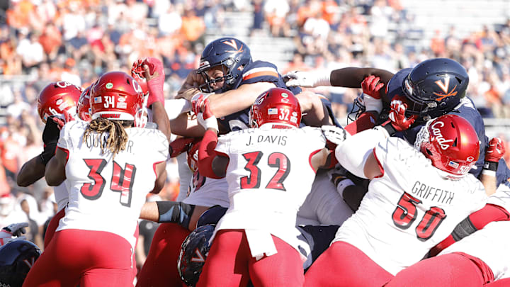 Oct 12, 2024; Charlottesville, Virginia, USA; Virginia Cavaliers quarterback Grady Brosterhous (19) scores a touchdown during the first half against the Louisville Cardinals at Scott Stadium. Mandatory Credit: Amber Searls-Imagn Images Oct 12, 2024; Charlottesville, Virginia, USA; Virginia Cavaliers quarterback Grady Brosterhous (19) scores a touchdown during the first half against the Louisville Cardinals at Scott Stadium. Mandatory Credit: Amber Searls-Imagn Images