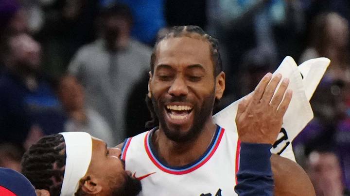 Kawhi Leonard celebrates with teammates after making the game-winning shot in overtime. Kawhi Leonard celebrates with teammates after making the game-winning shot in overtime.