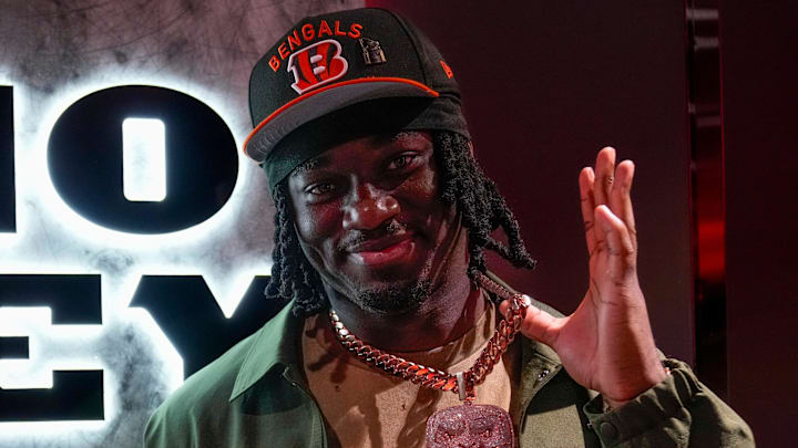 Cincinnati Bengals first round draft pick Shemar Stewart and his dad Moe Marquez show off custom jewelry they had made for each other in the Bengals locker room at Paycor Stadium in downtown Cincinnati on Friday, April 25, 2025.