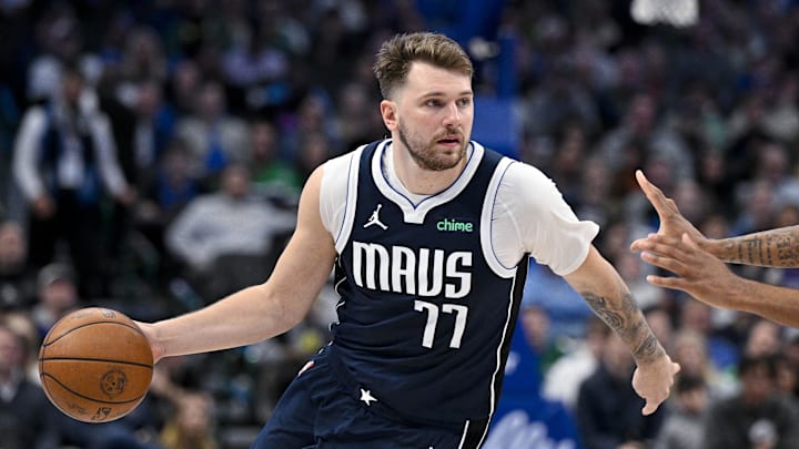Feb 12, 2024; Dallas, Texas, USA; Dallas Mavericks guard Luka Doncic (77) brings the ball up court against the Washington Wizards during the second half at the American Airlines Center. Mandatory Credit: Jerome Miron-Imagn Images