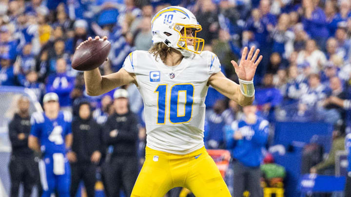 Dec 26, 2022; Indianapolis, Indiana, USA; Los Angeles Chargers quarterback Justin Herbert (10)  passes the ball in the first half against the Indianapolis Colts at Lucas Oil Stadium. Mandatory Credit: Trevor Ruszkowski-Imagn Images