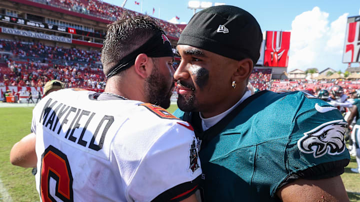 Sep 29, 2024; Tampa, Florida, USA; Philadelphia Eagles quarterback Jalen Hurts (1) greets Tampa Bay Buccaneers quarterback Baker Mayfield (6) Mandatory Credit: Nathan Ray Seebeck-Imagn Images