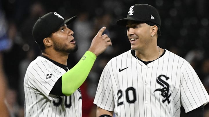 Chicago White Sox first baseman Lenyn Sosa (50) celebrates with third baseman Miguel Vargas (20) after defeating the Tampa Bay Rays at Rate Field. 