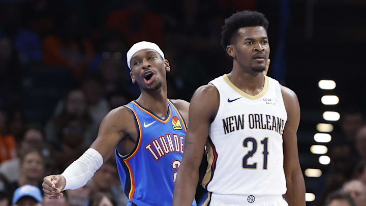Nov 13, 2024; Oklahoma City, Oklahoma, USA; Oklahoma City Thunder guard Shai Gilgeous-Alexander (2) gestures from behind New Orleans Pelicans center Yves Missi (21) after a play against the New Orleans Pelicans during the second half at Paycom Center. Mandatory Credit: Alonzo Adams-Imagn Images