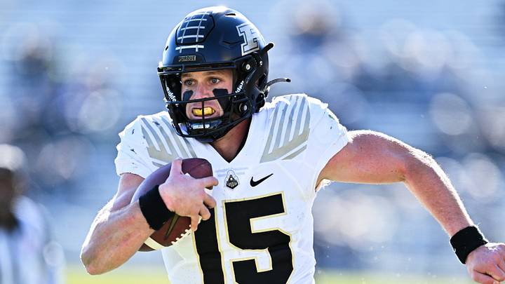 Purdue Boilermakers quarterback Ryan Browne (15) runs the ball. Purdue Boilermakers quarterback Ryan Browne (15) runs the ball.