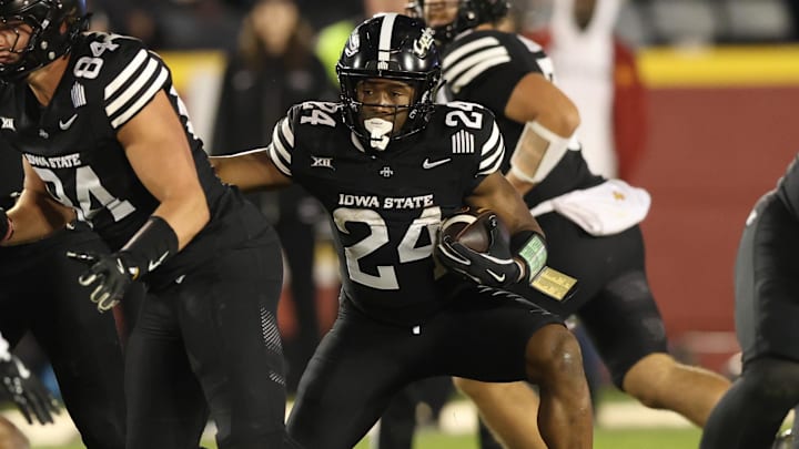 Nov 16, 2024; Ames, Iowa, USA; Iowa State Cyclones running back Abu Sama III (24) runs the football against the Cincinnati Bearcats at Jack Trice Stadium. The Iowa State Cyclones won the game 34-17.  Mandatory Credit: Reese Strickland-Imagn Images