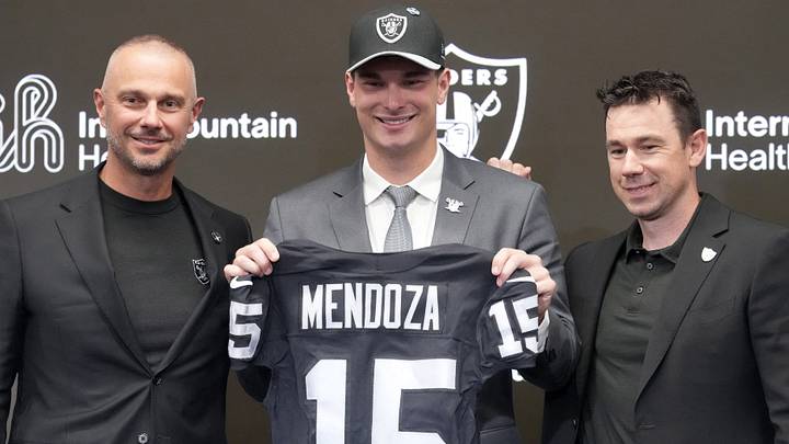 Apr 24, 2026; Henderson, NV, USA; Las Vegas Raiders quarterback Fernando Mendoza (center) poses with general manager John Spytek (left) and head coach Klint Kubiak at introductory press conference at Intermountain Health Performance Center after being selected as the No. 1 pick in the 2026 NFL Draft. Mandatory Credit: Kirby Lee-Imagn Images Apr 24, 2026; Henderson, NV, USA; Las Vegas Raiders quarterback Fernando Mendoza (center) poses with general manager John Spytek (left) and head coach Klint Kubiak at introductory press conference at Intermountain Health Performance Center after being selected as the No. 1 pick in the 2026 NFL Draft. Mandatory Credit: Kirby Lee-Imagn Images