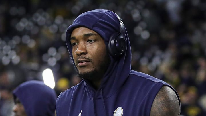 Michigan defensive end Derrick Moore warm up before the national championship game at NRG Stadium in Houston on Monday, Jan. 8, 2024.