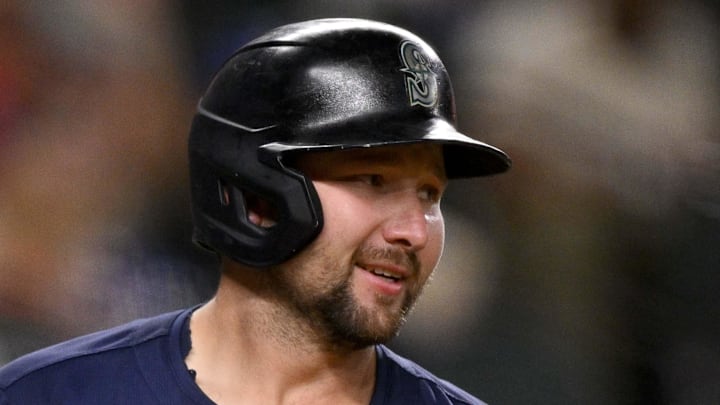 Seattle Mariners catcher Cal Raleigh (29) smiles as after he misses on a pitch thrown
