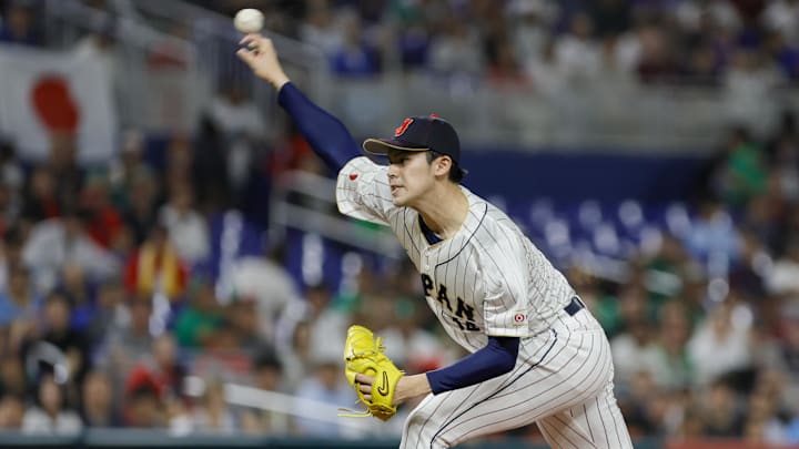 Mar 20, 2023; Miami, Florida, USA; Japan starting pitcher Roki Sasaki (14) delivers a pitch during the first inning against Mexico at LoanDepot Park Mar 20, 2023; Miami, Florida, USA; Japan starting pitcher Roki Sasaki (14) delivers a pitch during the first inning against Mexico at LoanDepot Park