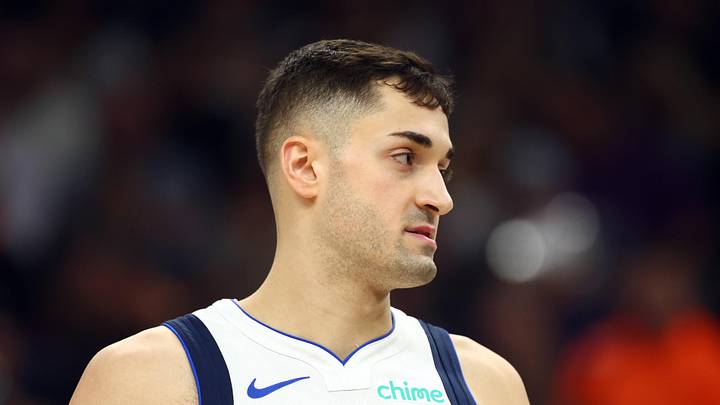 Dallas Mavericks guard John Poulakidas (1) 
