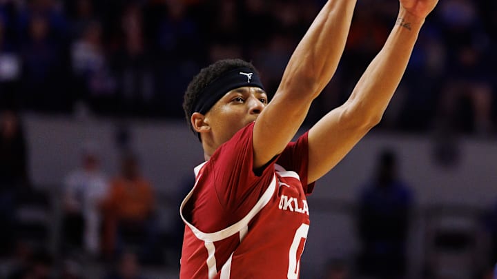 Feb 18, 2025; Gainesville, Florida, USA; Oklahoma Sooners guard Jeremiah Fears (0) shoots a three point basket against the Florida Gators during the first half at Exactech Arena at the Stephen C. O'Connell Center. Mandatory Credit: Matt Pendleton-Imagn Images