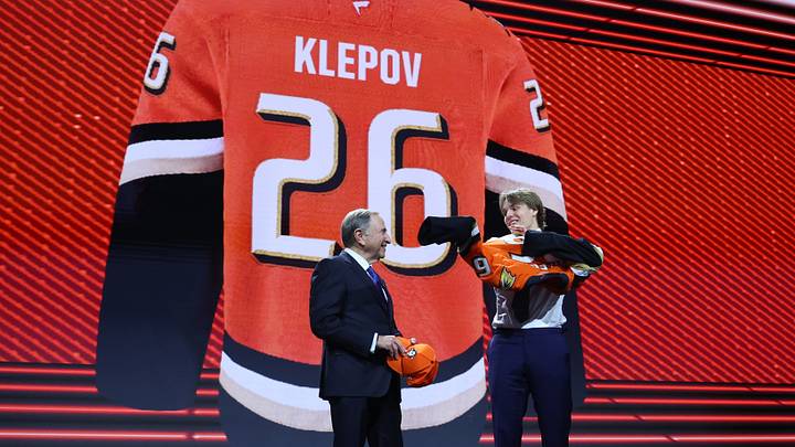 Jun 26, 2026; Buffalo, New York, USA; Nikita Klepov reacts beside NHL commissioner Gary Bettman after being selected with the fifteenth pick in the first round of the 2026 NHL Draft by the Anaheim Ducks at KeyBank Center. Mandatory Credit: Timothy T. Ludwig-Imagn Images