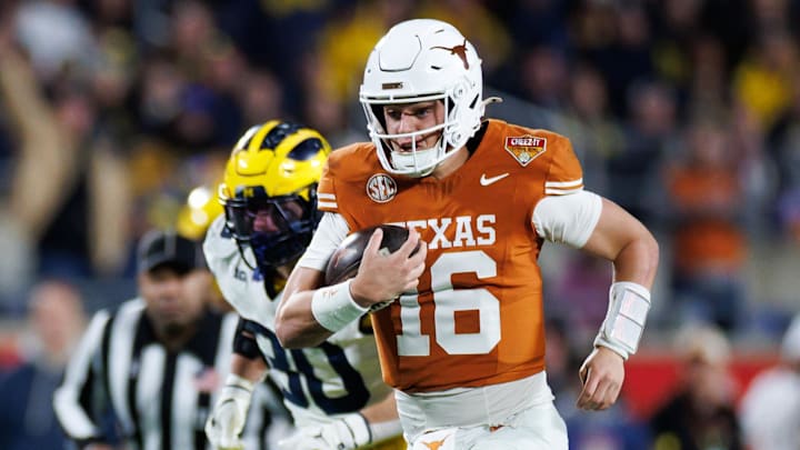 Texas Longhorns quarterback Arch Manning (16) rushes with the ball for a touchdown against the Michigan Wolverines during the second half at Camping World Stadium. Texas Longhorns quarterback Arch Manning (16) rushes with the ball for a touchdown against the Michigan Wolverines during the second half at Camping World Stadium.
