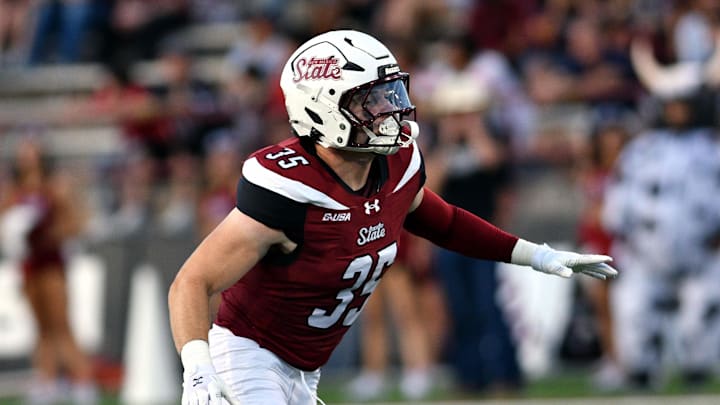 Linebacker Tyler Martinez drops back in pass coverage as the Aggies opened their season on Saturday night against the Bryant Bulldogs at Aggie Memorial Stadium. Linebacker Tyler Martinez drops back in pass coverage as the Aggies opened their season on Saturday night against the Bryant Bulldogs at Aggie Memorial Stadium.