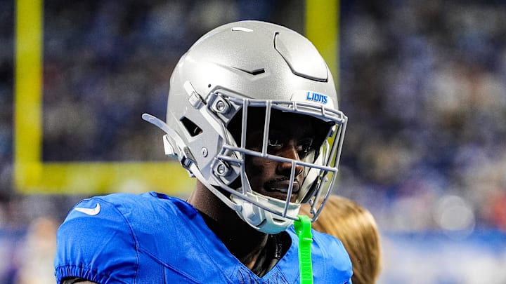 Detroit Lions cornerback Terrion Arnold (6) talks to running backs coach Tashard Rice 