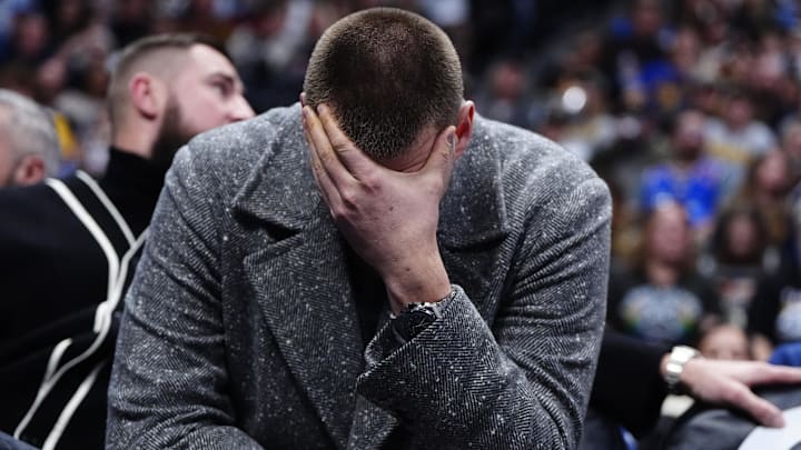 Jan 18, 2026; Denver, Colorado, USA; Denver Nuggets center Nikola Jokic (15) reacts from the bench in the third quarter against the Charlotte Hornets at Ball Arena. Mandatory Credit: Ron Chenoy-Imagn Images