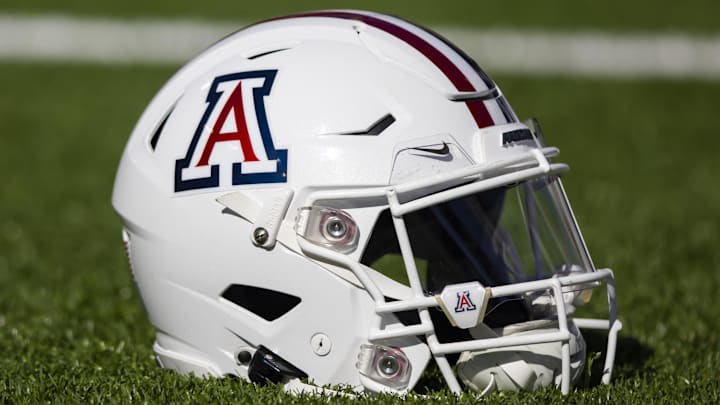 Nov 25, 2022; Tucson, Arizona, USA; Detailed view of an Arizona Wildcats helmet on the field during the Territorial Cup at Arizona Stadium. Mandatory Credit: Mark J. Rebilas-Imagn Images Nov 25, 2022; Tucson, Arizona, USA; Detailed view of an Arizona Wildcats helmet on the field during the Territorial Cup at Arizona Stadium. Mandatory Credit: Mark J. Rebilas-Imagn Images