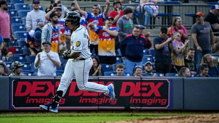 Akron infielder Ralphy Velazquez (24) reacts after hitting a solo home run during the home opening day game against Reading, April 2, 2026, in Akron, Ohio.