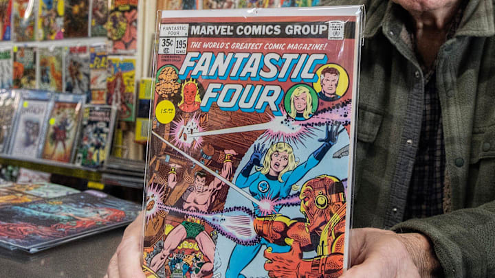 Al Greco, owner of Al's Comics, holds an issue of the Fantastic Four comic book at his shop on the
