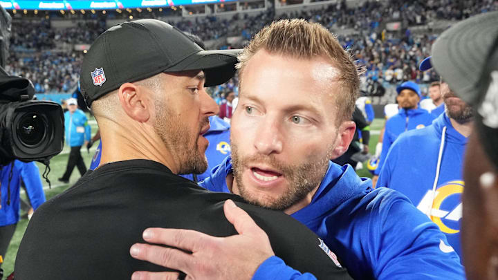 Jan 10, 2026; Charlotte, NC, USA; Los Angeles Rams head coach Sean McVay and Carolina Panthers head coach Dave Canales meet after the game in the NFC Wild Card Round game at Bank of America Stadium. Mandatory Credit: Bob Donnan-Imagn Images