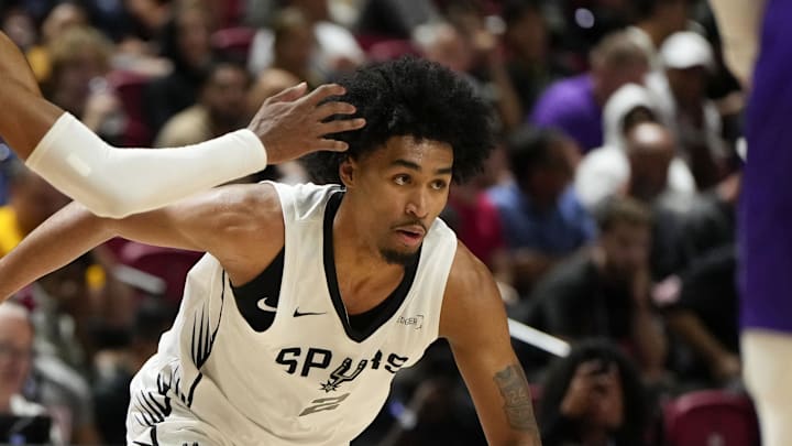 Jul 14, 2025; Las Vegas, NV, USA; San Antonio Spurs guard Dylan Harper dribbles the ball against Utah Jazz forward Cody Williams (5) during the second half of a NBA basketball game at the Thomas & Mack Center. Mandatory Credit: Lucas Peltier-Imagn Images