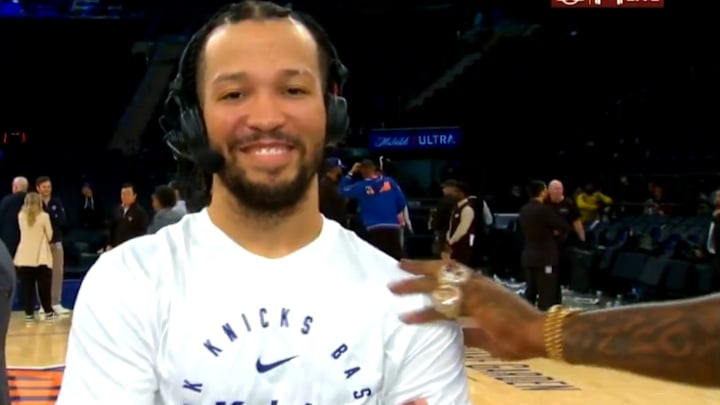 Smith rubs Brunson's shoulder in a postgame interview